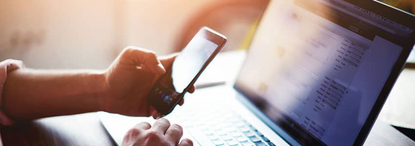 Mobile phone on laptop keyboard