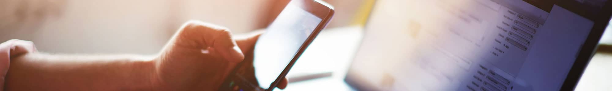 Mobile phone on laptop keyboard